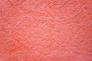 grainy red pink wall. rough surface texture