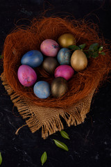 Quail eggs in rustic style on a dark background.