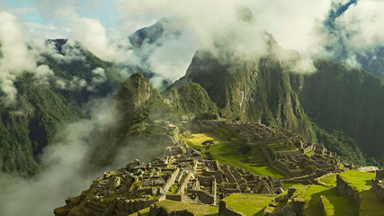 mist rising from a valley at machu picchu