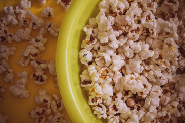 Tasty salted popcorn in bowl on white background. Flat lay of pop corn bowl. Top view. Pop corn-Close up