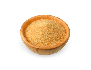 Brown refined sugar in wooden bowl on white background.