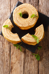 Baumkuchen, translated as tree cake, is a many-layered sponge cake baked on a rotating cylinder...