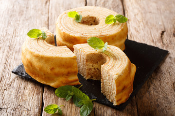 Baumkuchen, translated as tree cake, is a many-layered sponge cake baked on a rotating cylinder...
