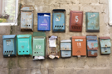 old rusty mailboxes in a communal house (translation is: post, for letters and newspapers, postbox)