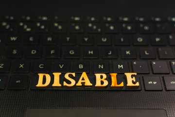 DISABLE the letters on the keyboard of the laptop