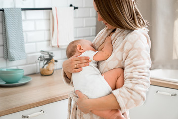 mom breast-feeds baby