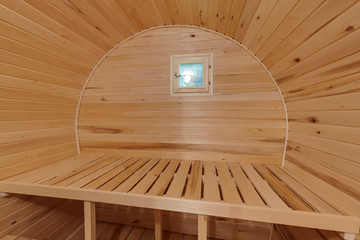interior of  wooden bath in the form of a barrel. Rural mobile bath