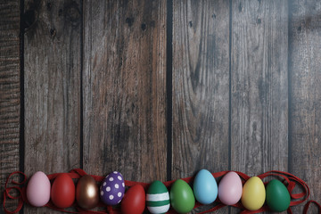 Flat-lay Easter eggs on wooden table.