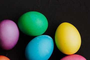 Colored easter eggs on a black background