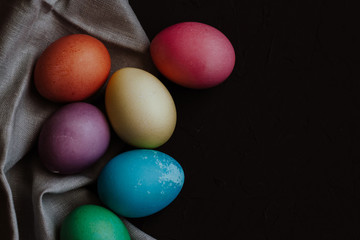 Colored easter eggs on a black background