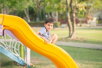 Little boy playing in the playground outdoor