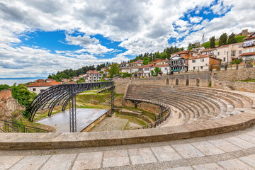 Ohrid - Macedonia. Antique ancient greek amphitheater or antique theatre of Ohrid with view on old...