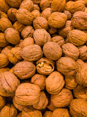 Natural walnut background pattern texture. Abstract walnuts heap pattern background.