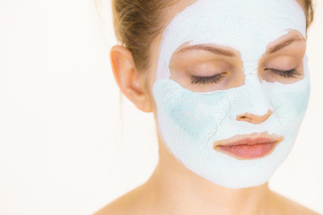 Girl with green mud mask on face