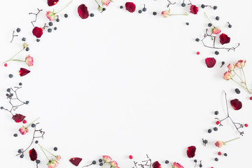 Autumn creative, modern composition. Frame made of berries, dry roses, petals on white background. Autumn, fall elegant concept. Flat lay, top view, copy space 