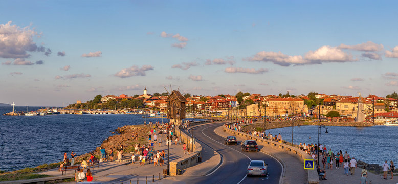 Nessebar, Bulgaria - August 09 2018: View of the old town of Nessebar (Bulgaria) UNESCO protected object - View of the windmill at sunset on the background of the clouds