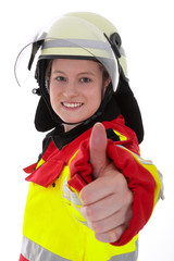 Notarzt Frau zeigt Daumen hoch und lächelt motiviert