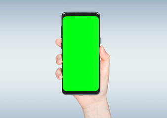 Woman hand holding modern smatphone mockup on white