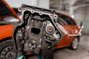 Selective focus. Engine Block on a repair stand with Piston and Connecting Rod of Automotive...