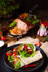Tasty wraps filled with pulled pork and salad