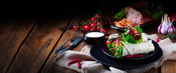 Tasty wraps filled with pulled pork and salad