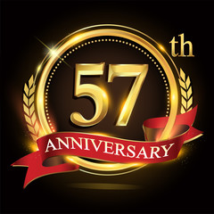 57th golden anniversary logo, with shiny ring and red ribbon, laurel wreath isolated on black background, vector design for birthday celebration.