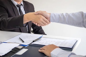 Successful job interview, Boss employer in suit and new employee shaking hands after negotiation and interview, career and placement concept