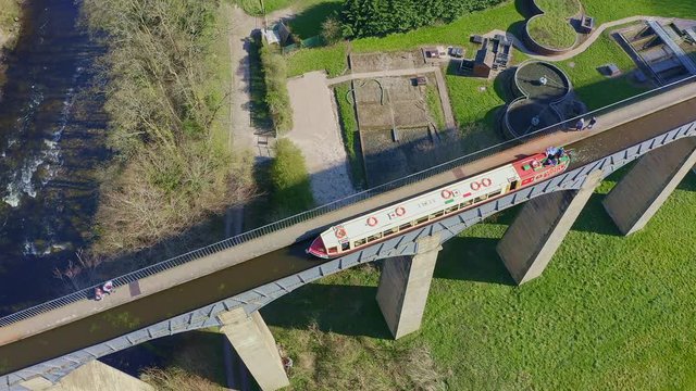 A stunning Viaduct, bridge on in the beautiful Welsh location of Pontcysyllte Aqueduct and the famous Llangollen canal route as a narrow boat crosses