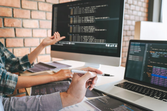 Team of Professional Developer programmer cooperation meeting and brainstorming and programming in website working a software and coding technology, writing codes and database