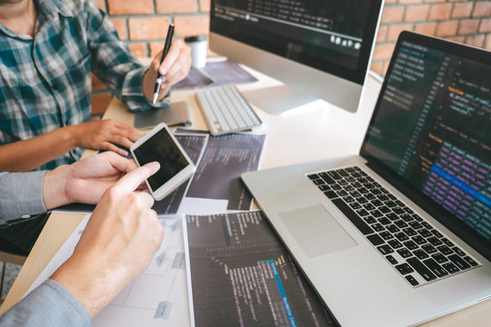 Developer programmer meeting and brainstorming in website working software