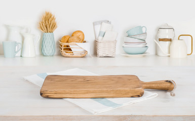 Fototapeta na wymiar Blurred kitchen counter background with cutting board and copy space