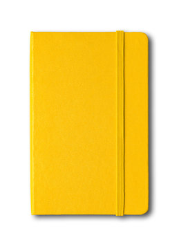 Yellow closed notebook isolated on white