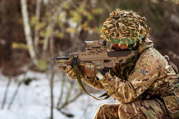 British special forces soldier with weapon take part in military maneuver. war, army, technology...