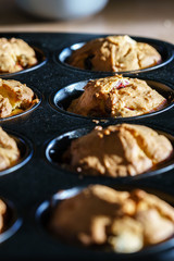 Row of freshly baked vegan vanilla cherry muffins