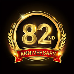 82nd golden anniversary logo, with shiny ring and red ribbon, laurel wreath isolated on black background, vector design