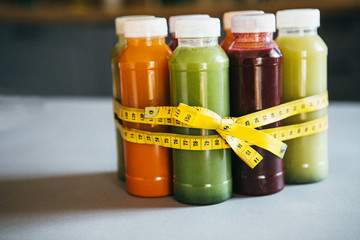 Detox juices and centimeter. The concept of proper nutrition and weight loss.