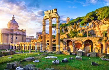 Tuinposter Roman Forum in Rome, Italy. Antique structures with columns and archs. Wrecks of ancient italian roman town. Church of Santi Luca e Martina. Sunrise above famous architectural landmark. © Yasonya