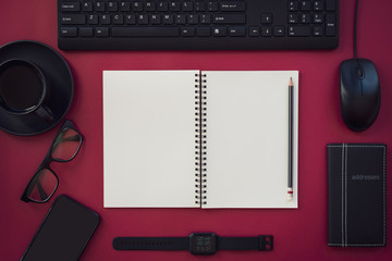 Blank white notepad with black office and personal accessories. - 260956556