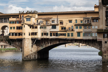 Fototapeta na wymiar Ponte Vecchio famous landmark bridge over the river in Firenze, Tuscany