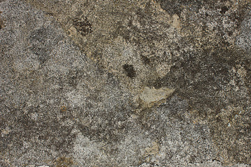 texture of an old gray concrete wall close-up in spots and scratches