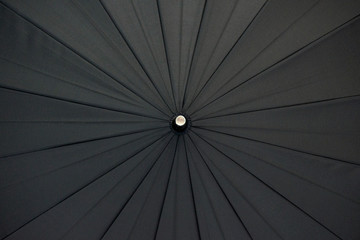 Texture of a black umbrella. Textile concept.