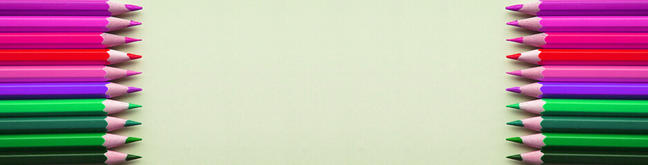Bright and sharp colorful pencils on gray background. Banner for your advertising or web site.