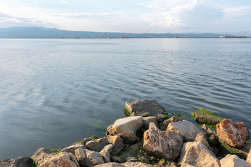 Fototapeta na wymiar Paisaje marino con nubes. Delta del Ebro