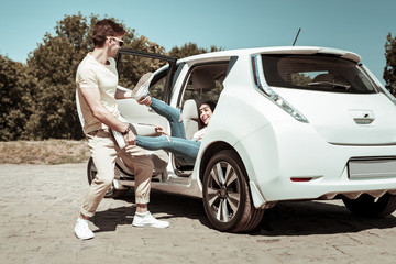 Joyful young male person looking at his partner