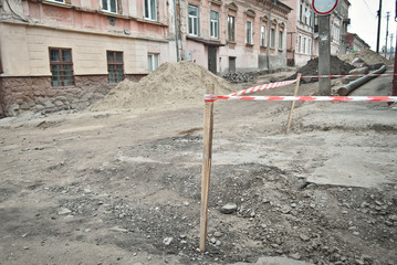 The street of the city is torn down. Construction and laying of pipelines and sewerage. Chernivtsi,...