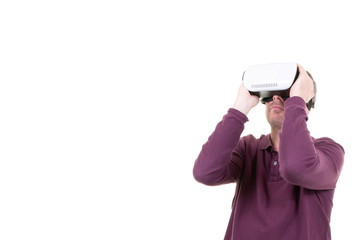man playing in virtual reality goggles in white background with copy space
