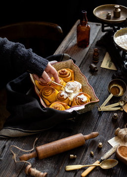 Homemade cinnamon pumpkin rolls in baking pan