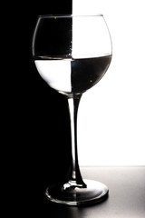 Glass of water with overlap in the form of a chessboard concept