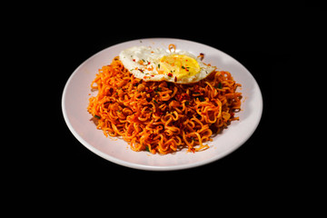 Fried noodle with egg on white plate