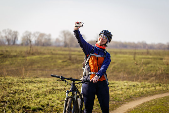 female cyclist makes selfie